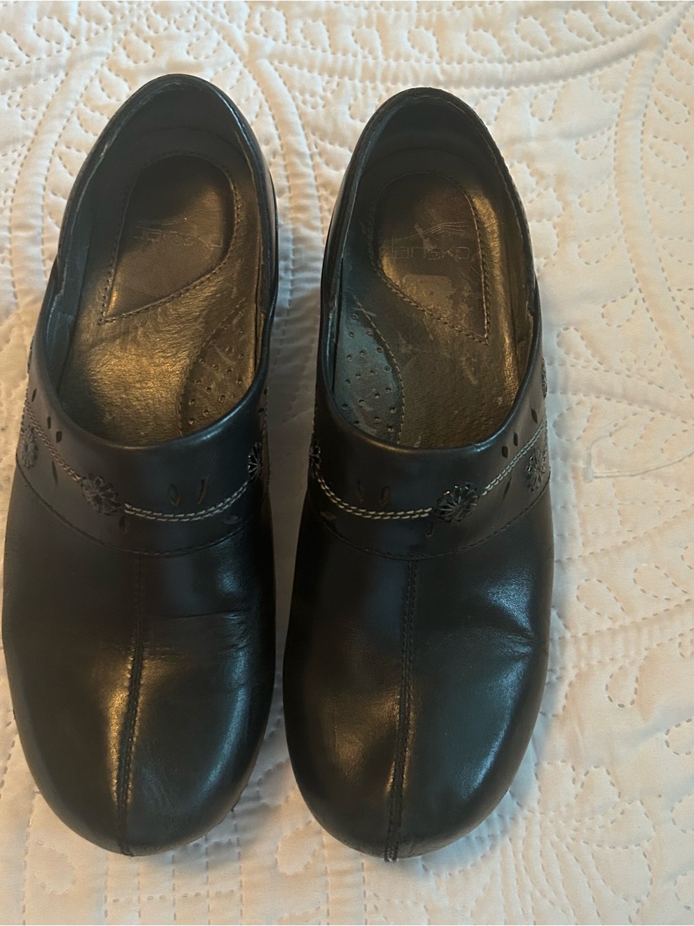 Dansko Black Leather Women's Slip-On Clogs with Stitch Detail
